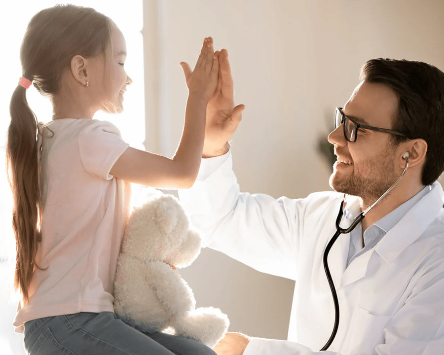 doctor high fiving little girl